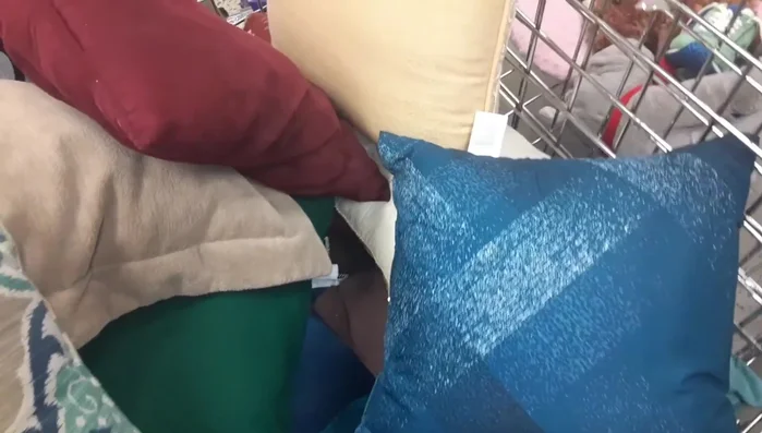 Add a pillow. You can either thrift one or make your own.