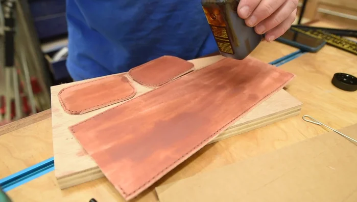 Rivet the belt clip onto the bag before stitching.