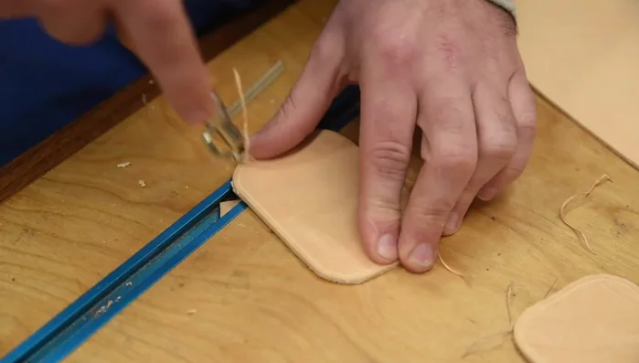 Punch holes along the grooved line using a diamond chisel.