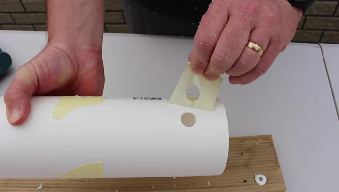Sand around each hole to smooth any rough edges.