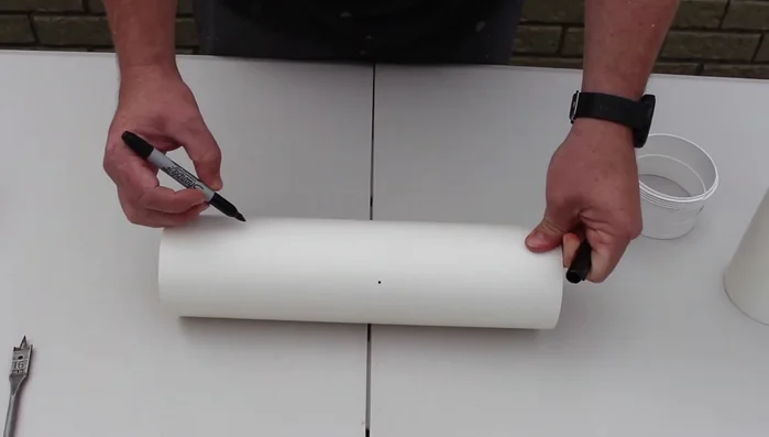 Sand around each hole to smooth any rough edges.