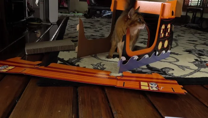 Attach the side pieces, potentially using the online video guide for clarification.