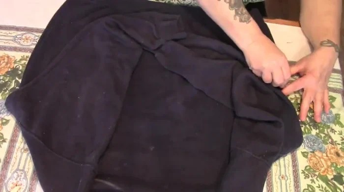 Cut along the bottom chalk line up to the sides. Do not cut along the top chalk line. Cut off the waistband.