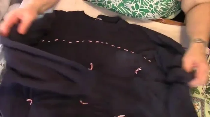 Stuff the sleeves and upper neck area. Put one sleeve inside the other and sew them together.