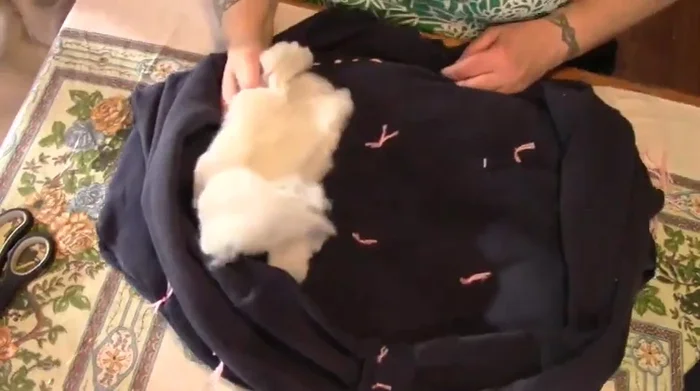 Sew up the neck hole.