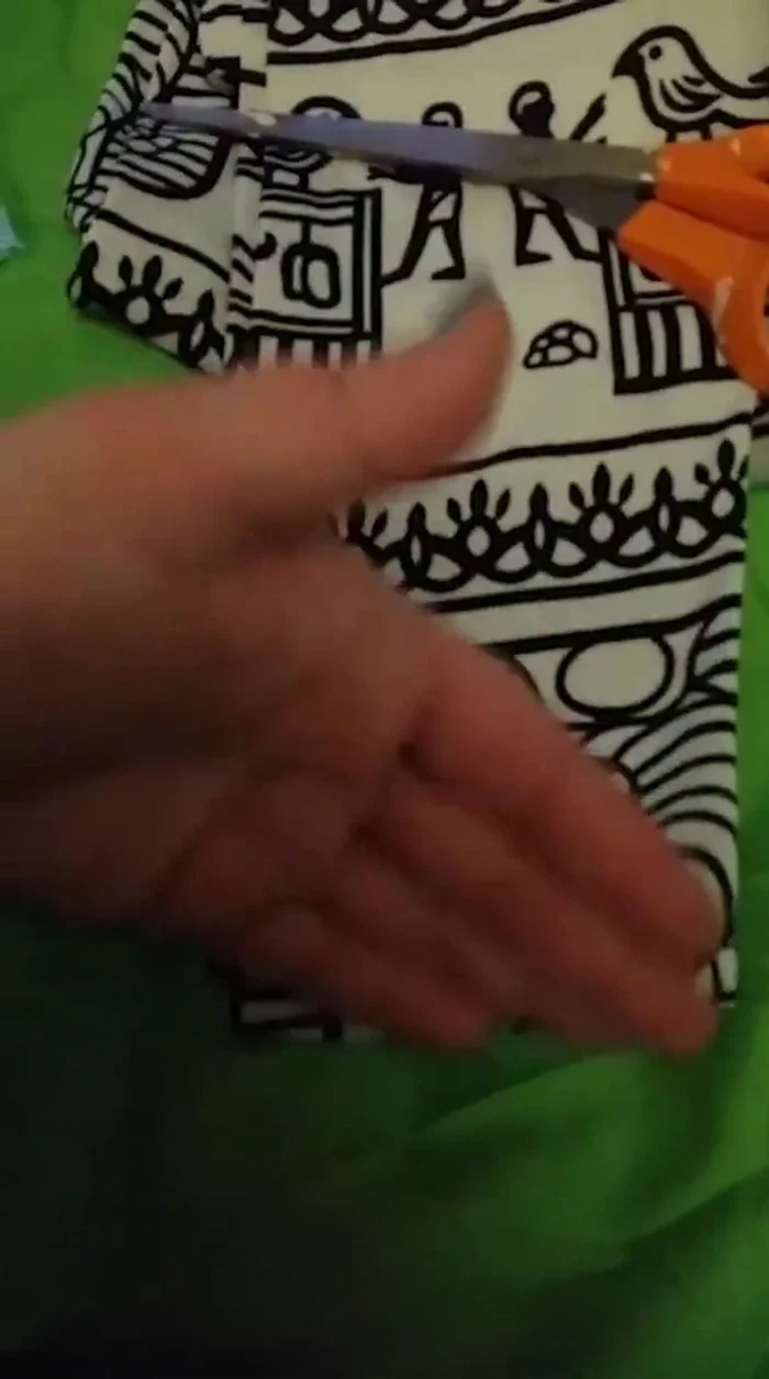 Cut off the excess leggings material from the measured waistline to create the body of the tank top.