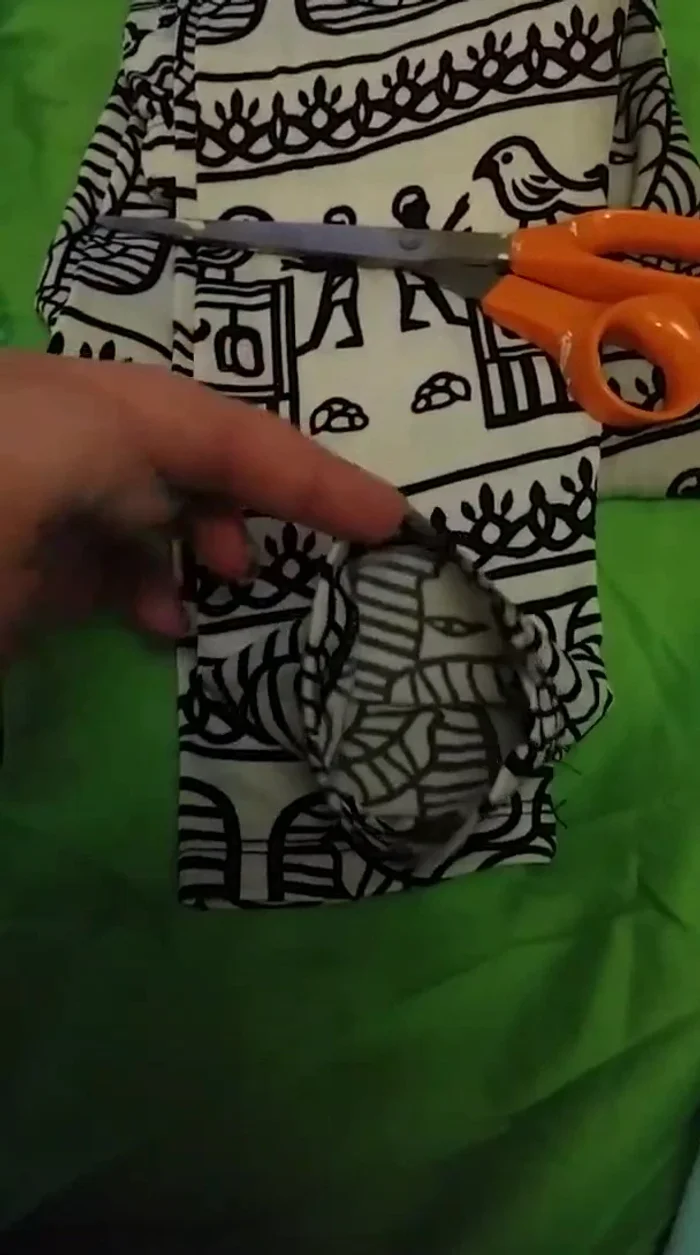 Cut off the excess leggings material from the measured waistline to create the body of the tank top.