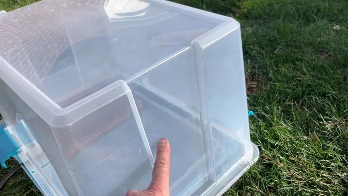 Create a cord slot: Cut a slot in the tub for the heating pad cord to exit the house.