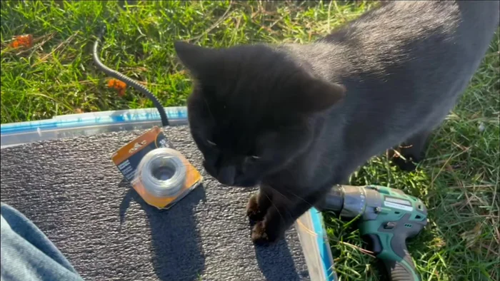 Secure the foam: Cut four small foam squares and use wire to fasten the corners of the main foam piece to these smaller squares, drilling holes in the plastic tub (or using heat to melt holes) to pass the wire through and securing it.
