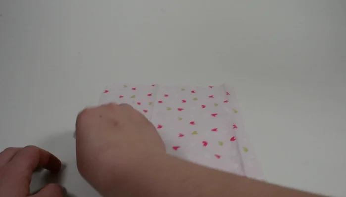 Fold the square fabric in half to form a triangle and cut at the fold. Use only one half.