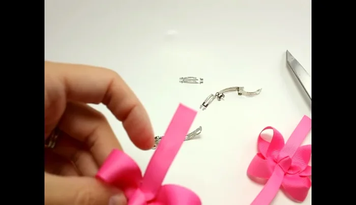 Attach the bow to the clip: Hot glue the finished bow onto the clip, ensuring a secure bond.