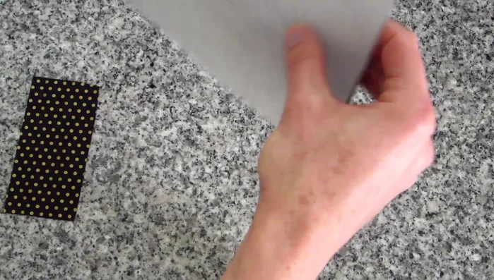 Prepare the bow piece: Fold the fabric lengthwise, stitch along the 1/4 inch edge, and then flip it right side out. Press the seam to the center.