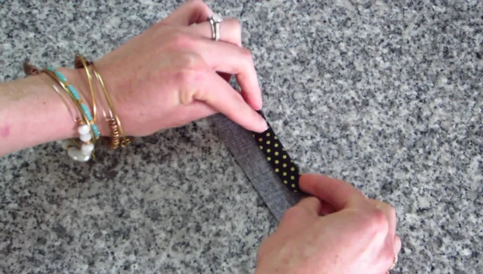 Prepare the center piece: Fold the center piece fabric wrong sides together, press. The size of the center piece can be adjusted.