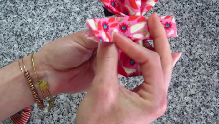 Attach Center Piece (Faster Method): Wrap the center piece's wrong side to the bow's right side, stitch close to the bow edge, and trim the excess.