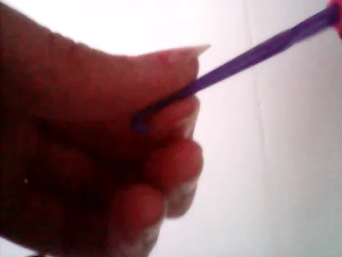 Once all colors are added, there will be a sort of tubular shape. At this point, the instruction notes some difficulties which are shown in the video and addressed with slight adjustment.