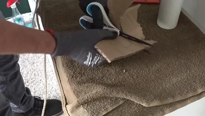 Cut a piece of cardboard with the same diameter as the PVC pipe. Make a slightly off-center hole in the cardboard.