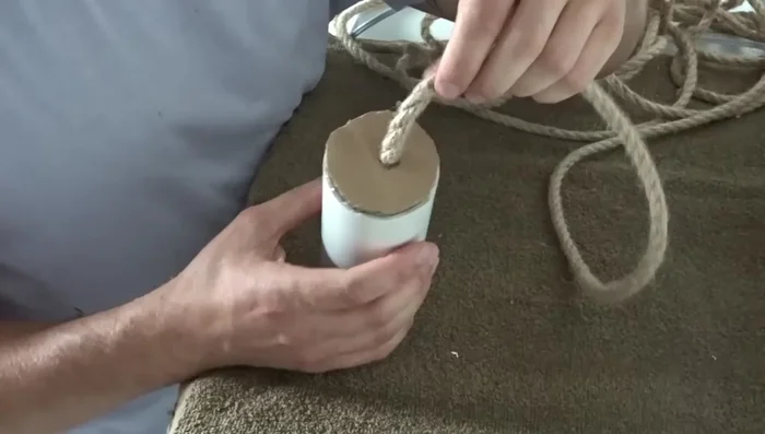 Once you reach the outer layer, apply a bead of glue all the way around to secure the rope.