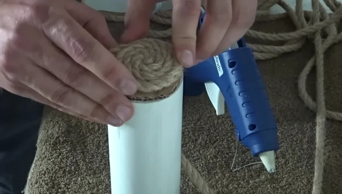 Once you reach the outer layer, apply a bead of glue all the way around to secure the rope.