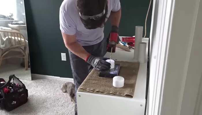 Drill a hole in the center of the PVC caps.