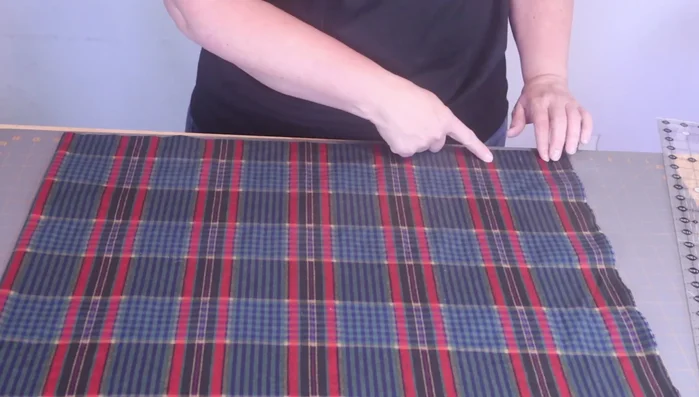 Sew two seams, approximately 1/2 inch from the edge, on the 22-inch side of your fabric piece. This step is repeated to reinforce the seams.