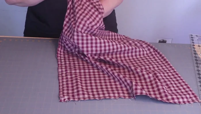 Turn the fabric right side out. Use the technique of folding the corners to easily turn the fabric inside out, creating crisp corners.