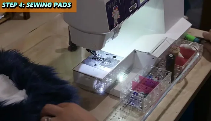 Brush out the seams and then pin and sew in the remaining smaller pads one at a time. Pin at the corners first, then fill in.