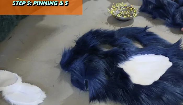 Brush out the seams and then pin and sew in the remaining smaller pads one at a time. Pin at the corners first, then fill in.