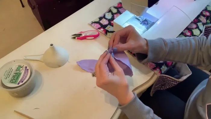 Sew the three pairs together, matching seams at the top, using a 1/4 inch seam allowance. Sew one side of each pair, leaving the bottom open for turning.