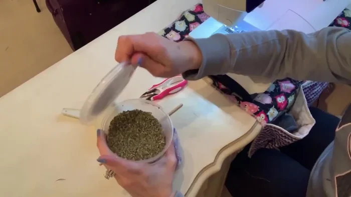 Add catnip and polyfill to the ball. Stuff firmly.