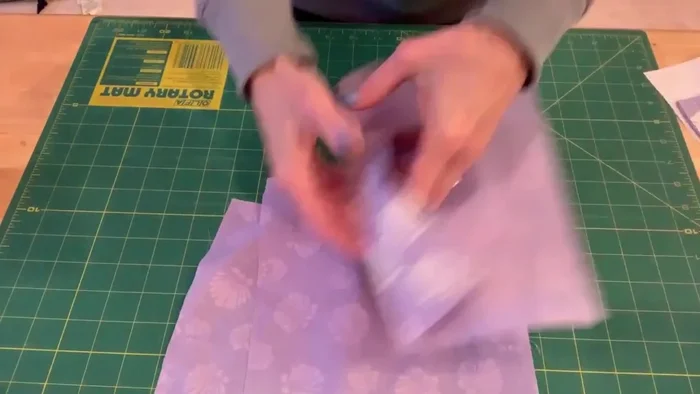 Cut out six fabric squares using the pattern.