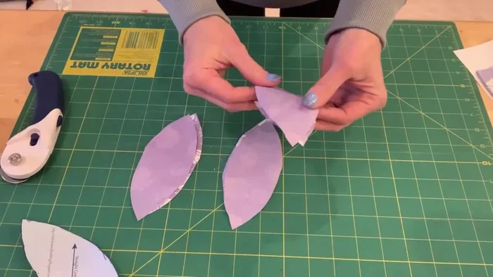 Sew two pieces together, right sides facing, using a 1/4 inch seam allowance. Repeat until you have three pairs of sewn squares.