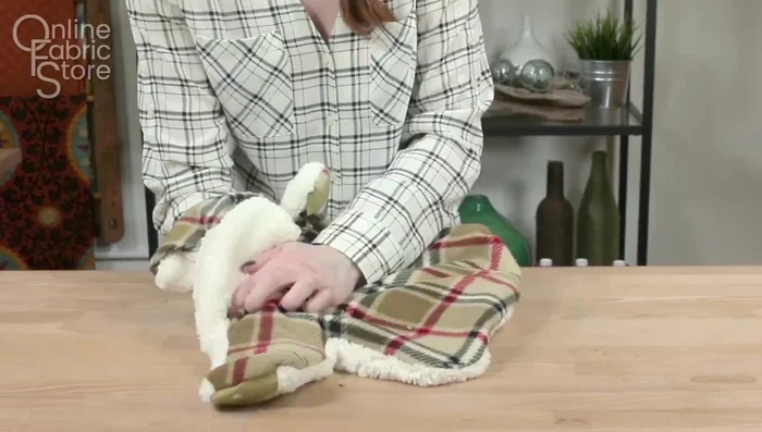 Turn and finish: Turn the coat right-side out and hand sew the gaps closed. Hand-sew the lining around the harness opening if applicable.