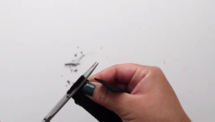 Burn the edges of the strap with a lighter to prevent fraying.