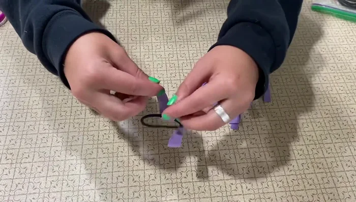 Repeat step 5 until the hair tie is full.