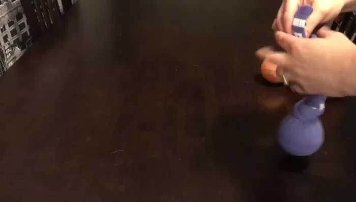 Place another tennis ball above the knot and tie another knot.