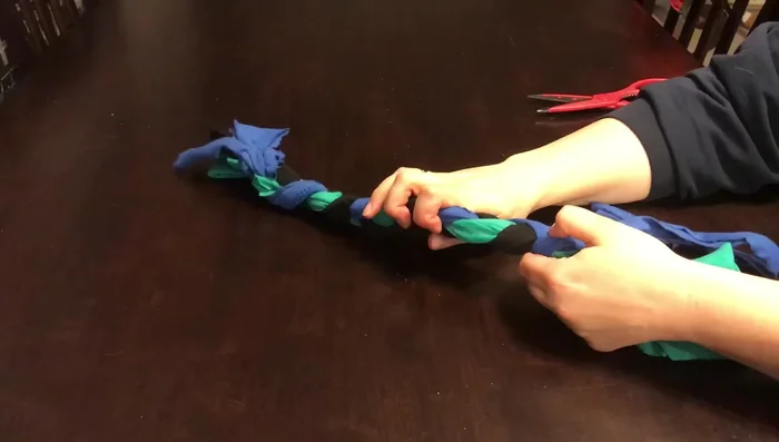 Tie the ends of the braid together.