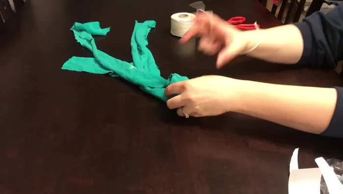 Tie twine or rope underneath the ball to secure it.