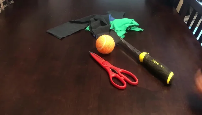 Braid strips of fabric into a long rope.