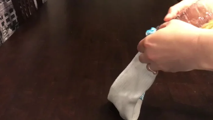 Tie a knot in the sock.