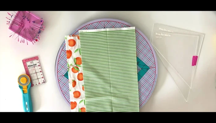 Cut out two identical pieces of fabric (front and back) using your chosen template, placing the template's 'place on fold' line along the fabric's fold.