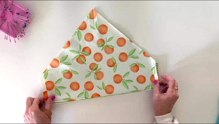 Stitch a 1/4 inch seam along the straight edges, stopping about a quarter-inch from the corners.