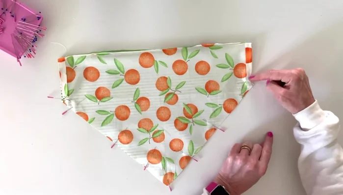 Stitch a 1/4 inch seam along the straight edges, stopping about a quarter-inch from the corners.