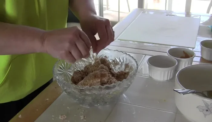 If the dough is too crumbly, add a couple of tablespoons of water and continue mixing until it forms a ball.