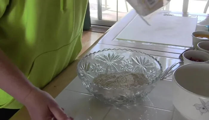 If the dough is too crumbly, add a couple of tablespoons of water and continue mixing until it forms a ball.