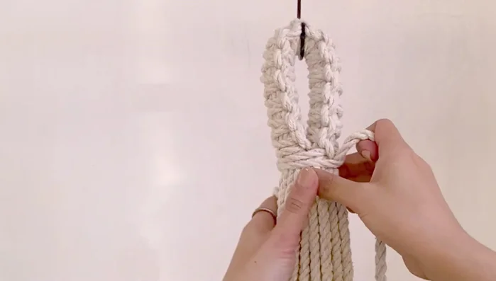 Create a spiral design using a series of inverted four knots until reaching the desired height (2.5 inches in this example).