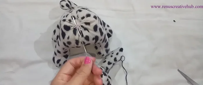 Add finishing touches and decorative stitches.