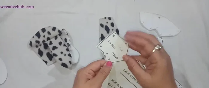 Sew the face details together.