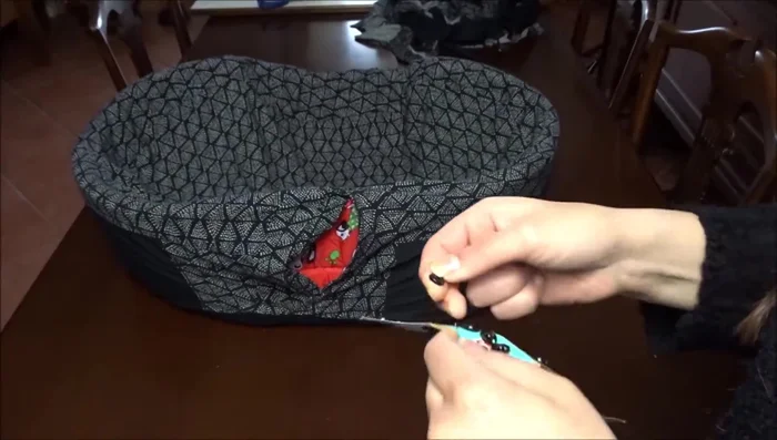 Insert the dog bed into the cover and attach snap fasteners along the opening.