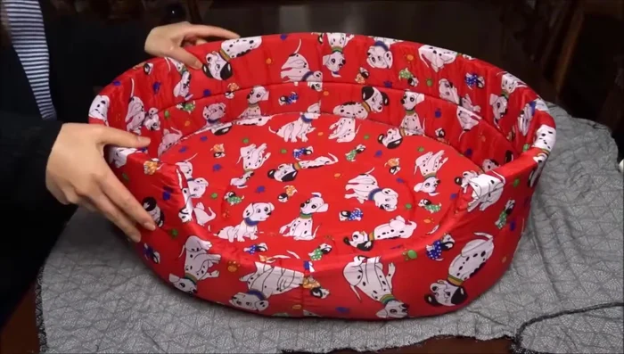 Use the dog bed's bottom as a pattern to cut the fabric for the top and bottom of the cover.