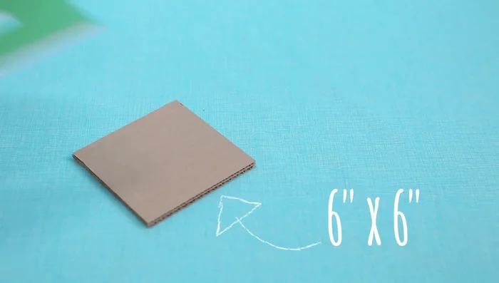 Use templates to trace and cut out the 3/4in x 3/4in square from the center of each cardboard square.